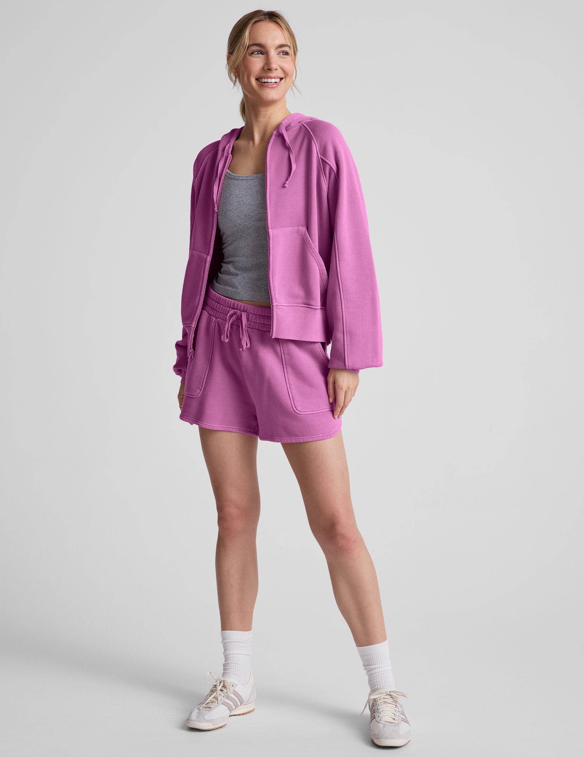 pink zip-up jacket with pockets and a hoodie.