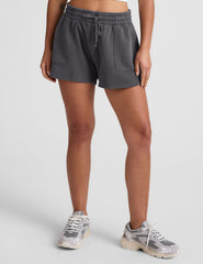 black shorts with patch pockets and a drawstring at waistband.