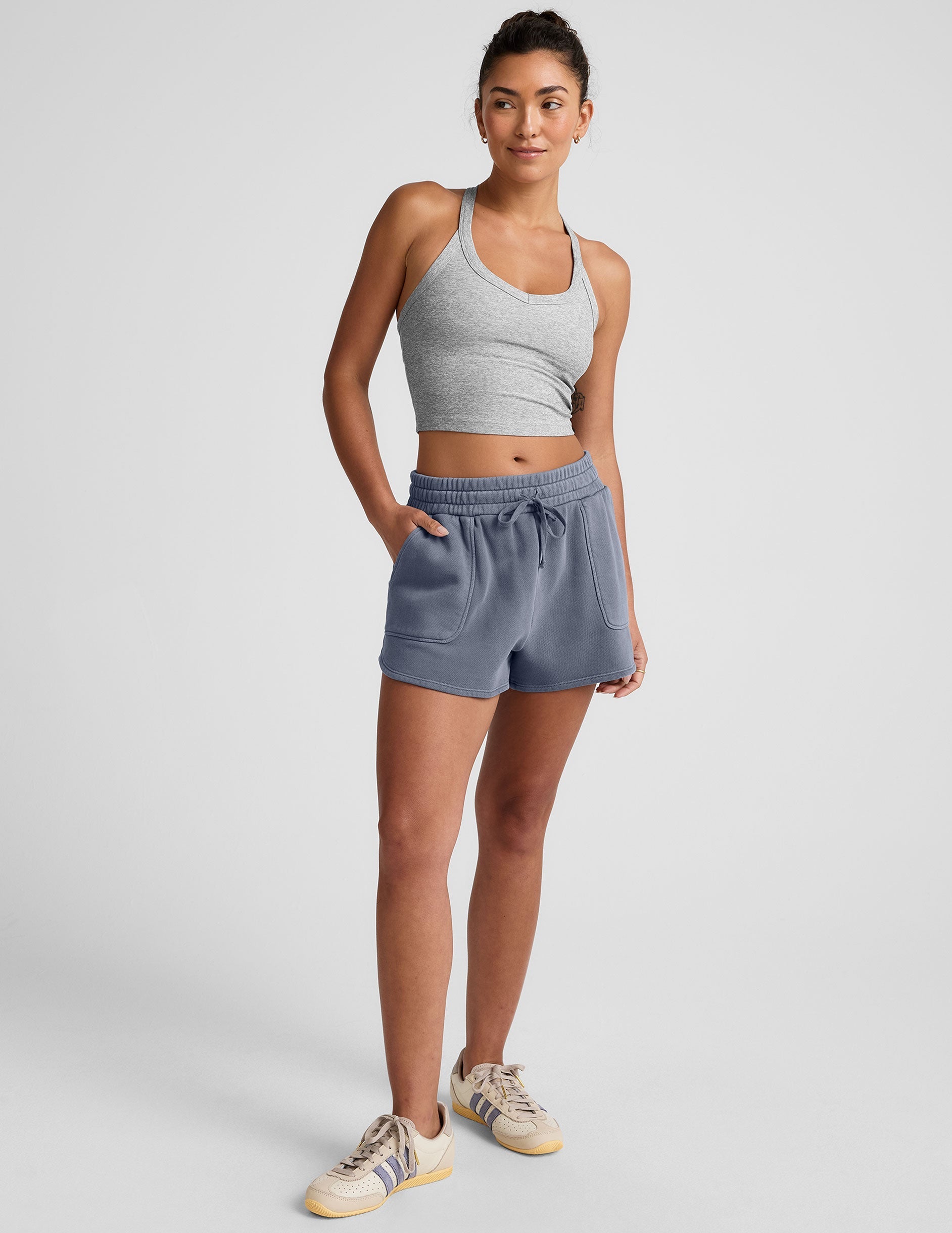 blue shorts with patch pockets and a drawstring at the waistband.