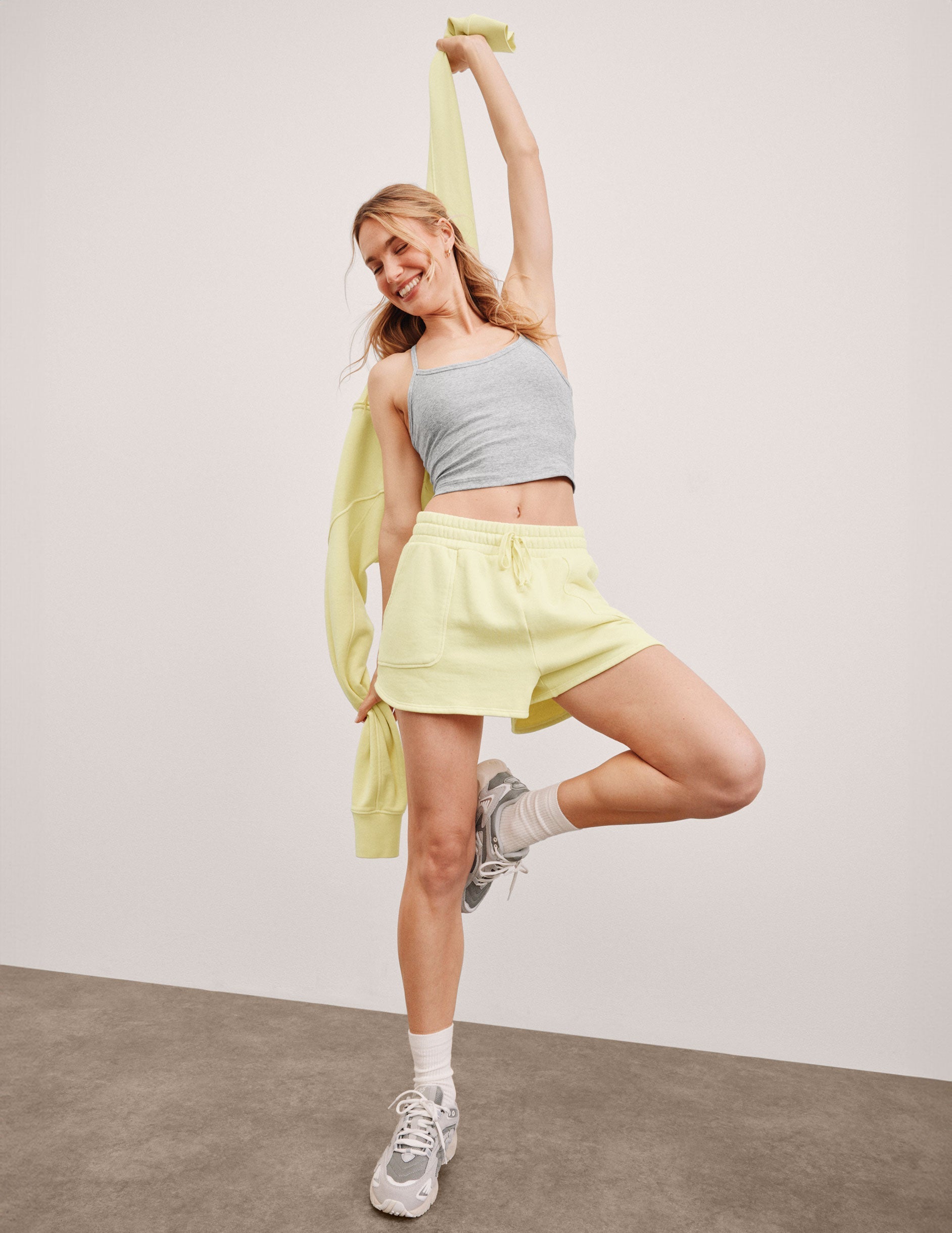 yellow terry shorts with pockets and a drawcord at waist.