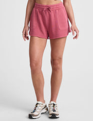 red terry shorts with pockets and a drawcord at waistband.