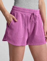 pink shorts with patch pockets and a drawstring at waistband.