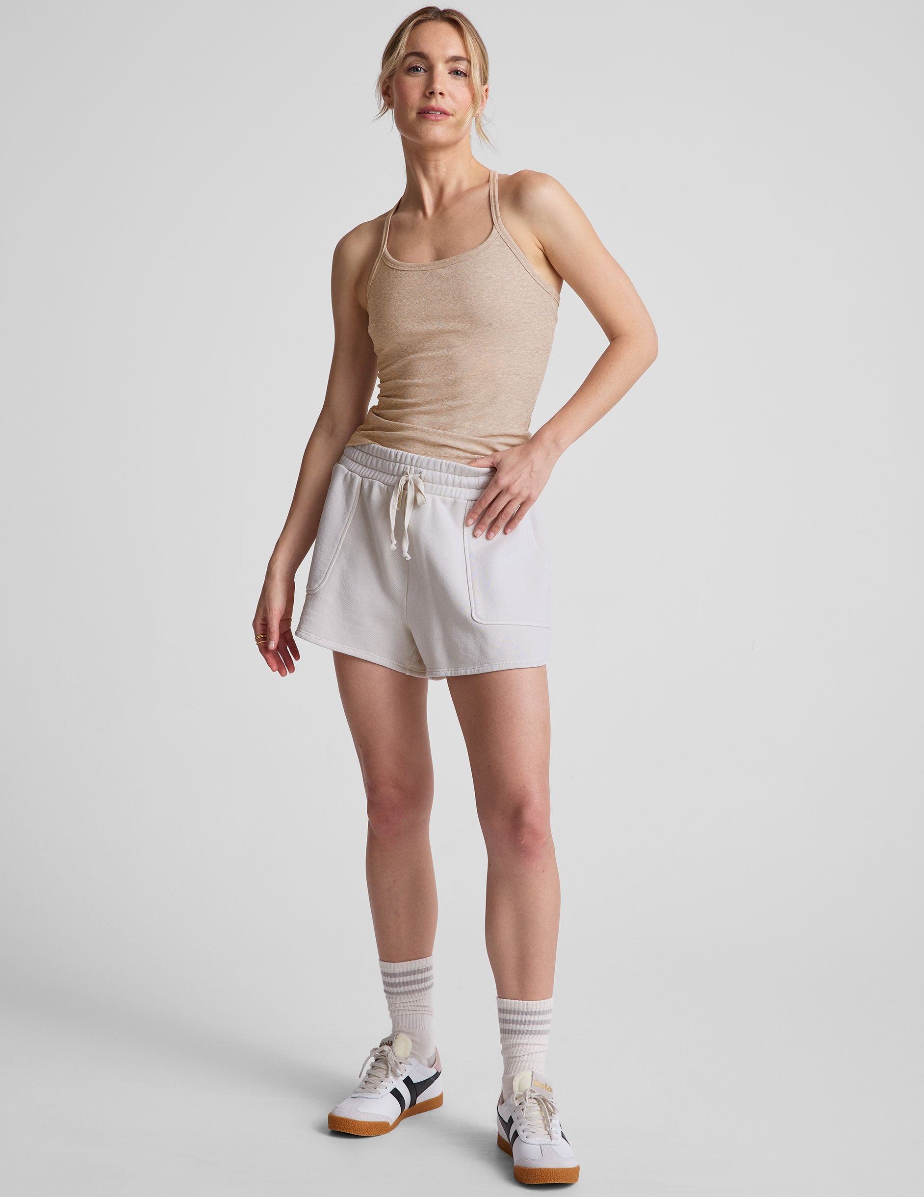 white relaxed fit terry shorts with patch pockets.