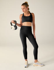 black scoop neck bra with crossover back detail.