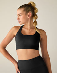 black scoop neck bra with crossover back detail.