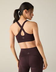 purple bra with cross straps on the back.