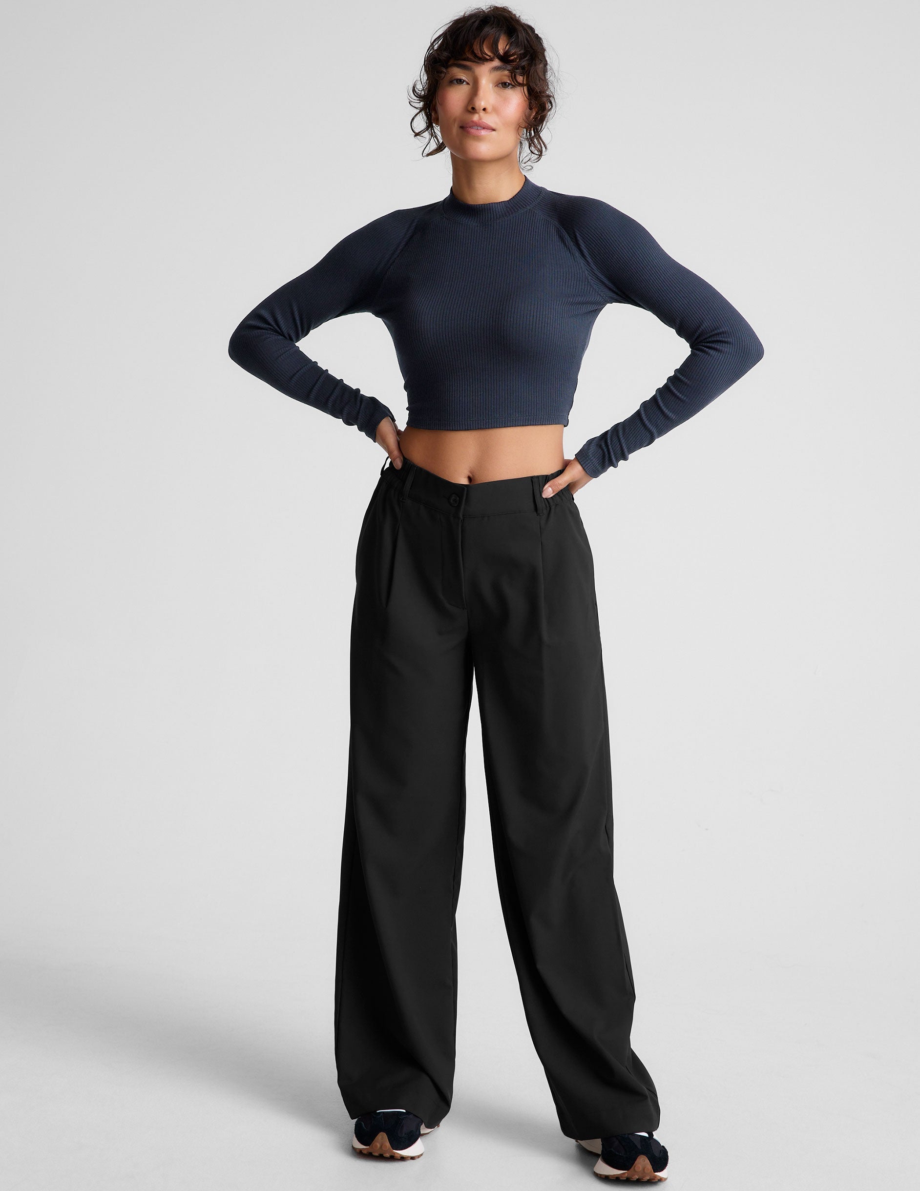 blue ribbed mock-neck cropped long sleeve top.