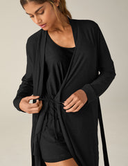 black sleep robe with a tie at the waist and side pockets.