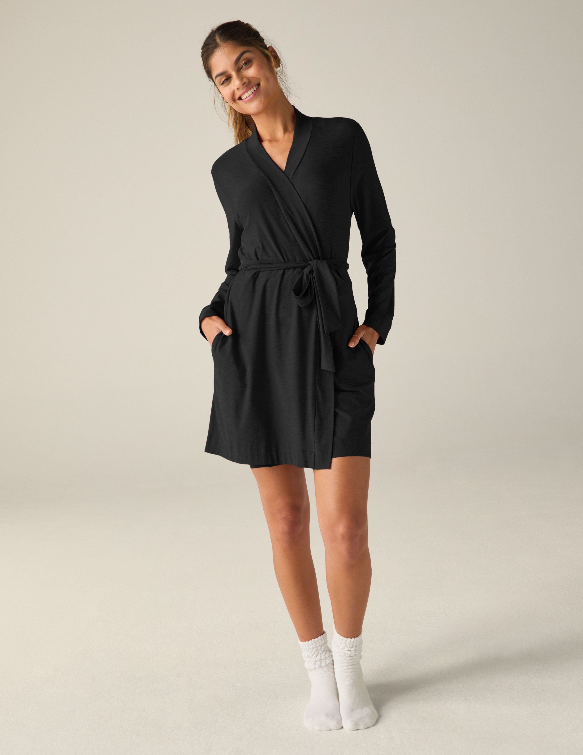 black sleep robe with a tie at the waist and side pockets.