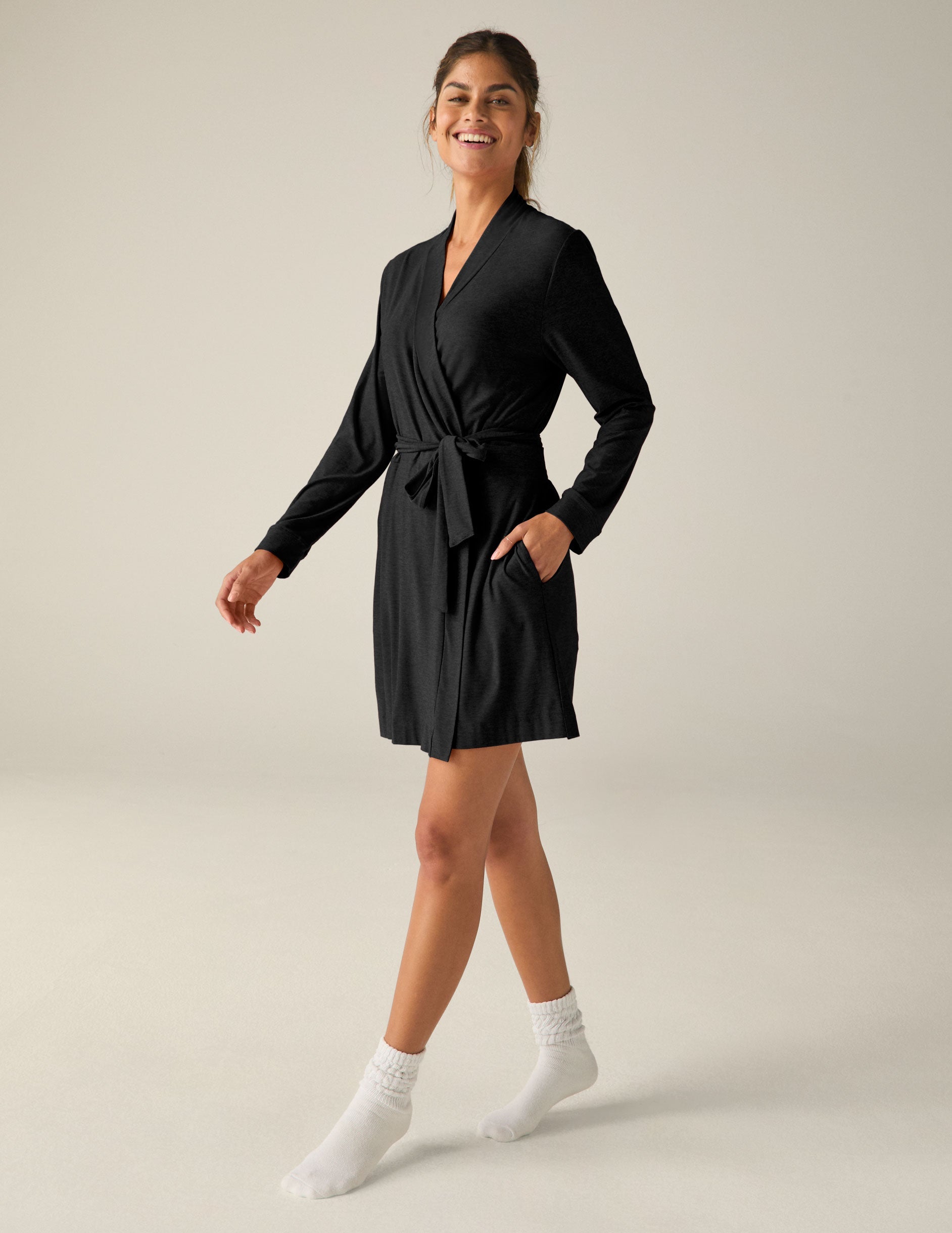 black sleep robe with a tie at the waist and side pockets.