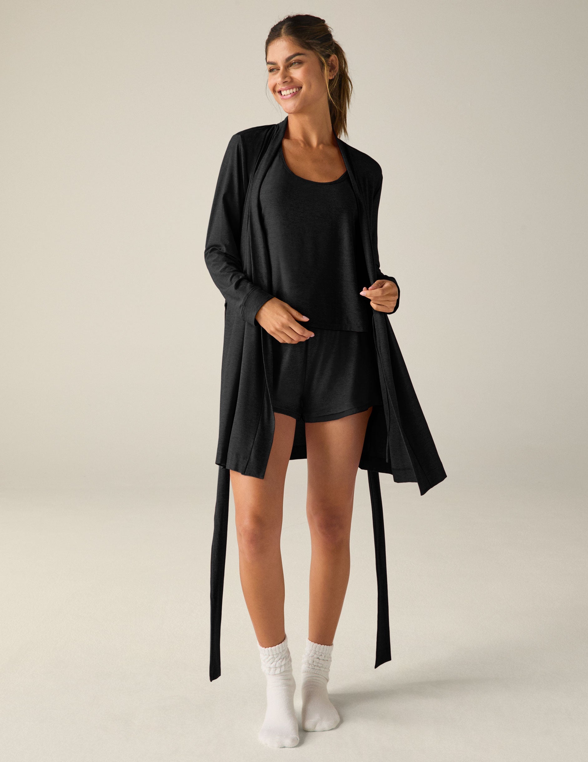 black sleep robe with a tie at the waist and side pockets.