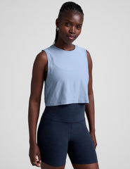 blue relaxed fit cropped tank top with a crew neckline.