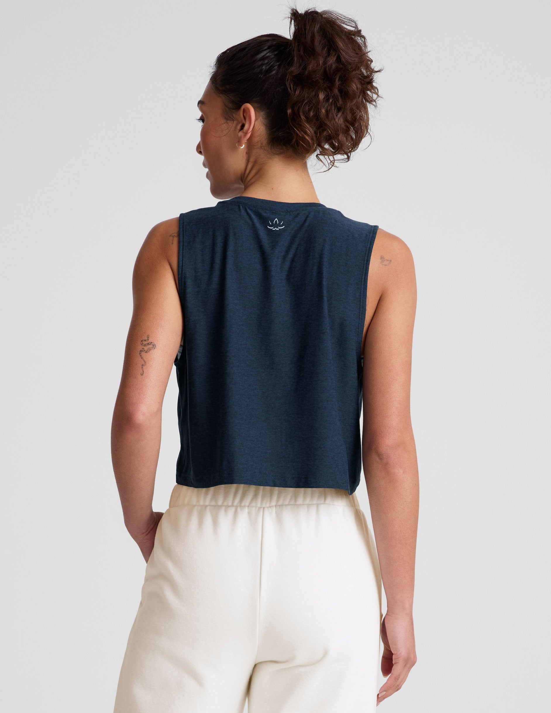 blue relaxed fit cropped tank with a scooped ribbed neckline and ribbed arm holes.