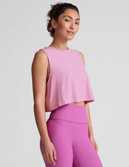 pink relaxed fit cropped tank with a scooped, ribbed neckline, and ribbed arm holes. 