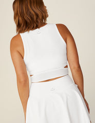 white cropped tank with wrap top and cutouts.