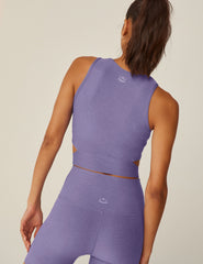 purple high-neck cropped tank top with a crossover detail in the front.