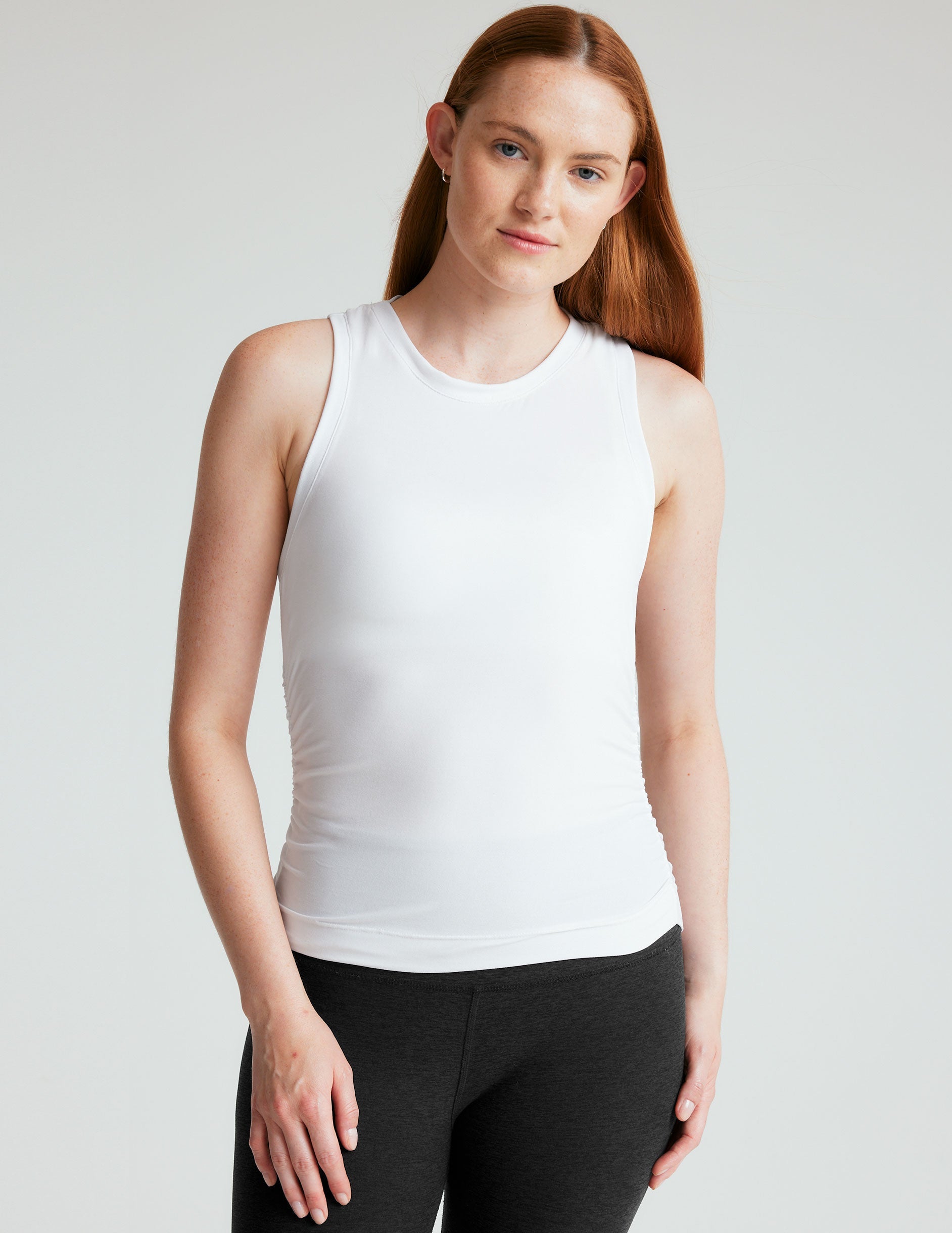 white tank with shirring details down the sides.