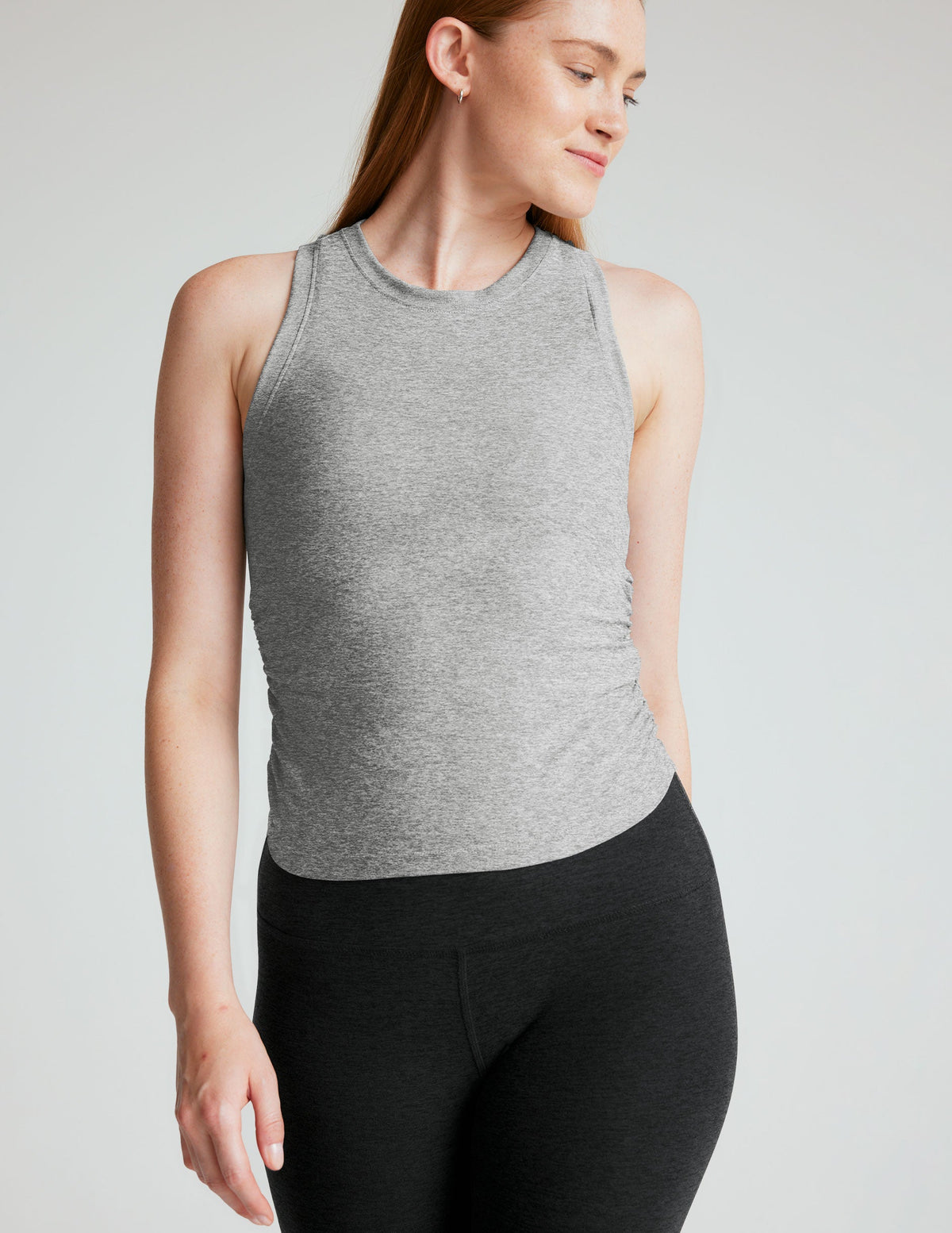 gray scoop neck tank top with shirring details down the sides.