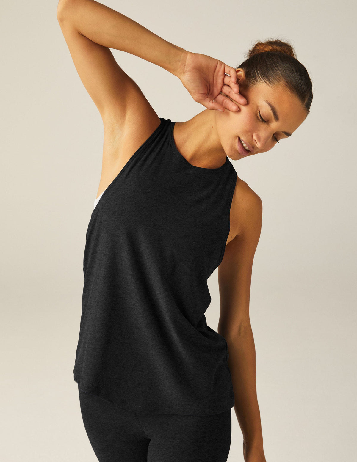 black racerback loose fitting tank top with a back keyhole with draping detail