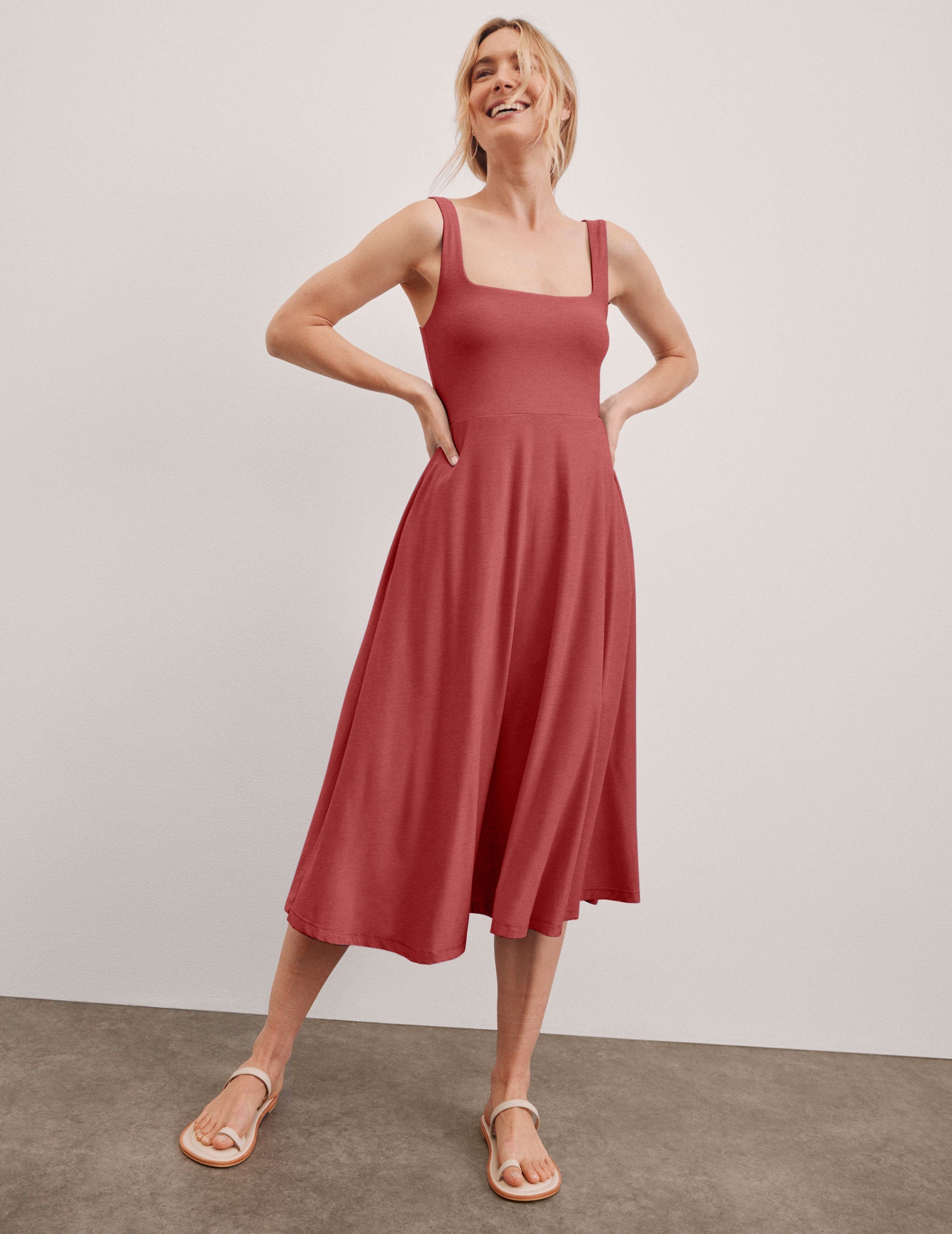 red square neck midi length dress with pockets.