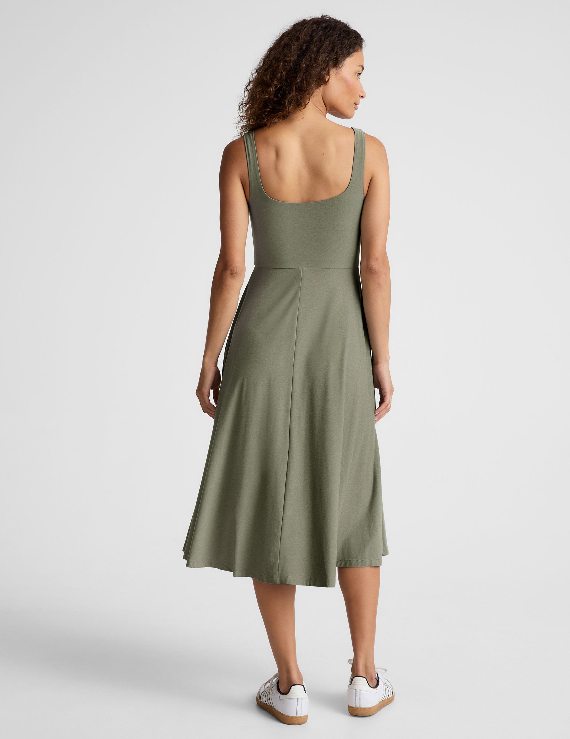 green midi length square neck dress with pockets.