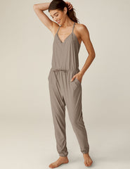 brown midi jumpsuit with a drawstring at waistband and lace trim detailing.