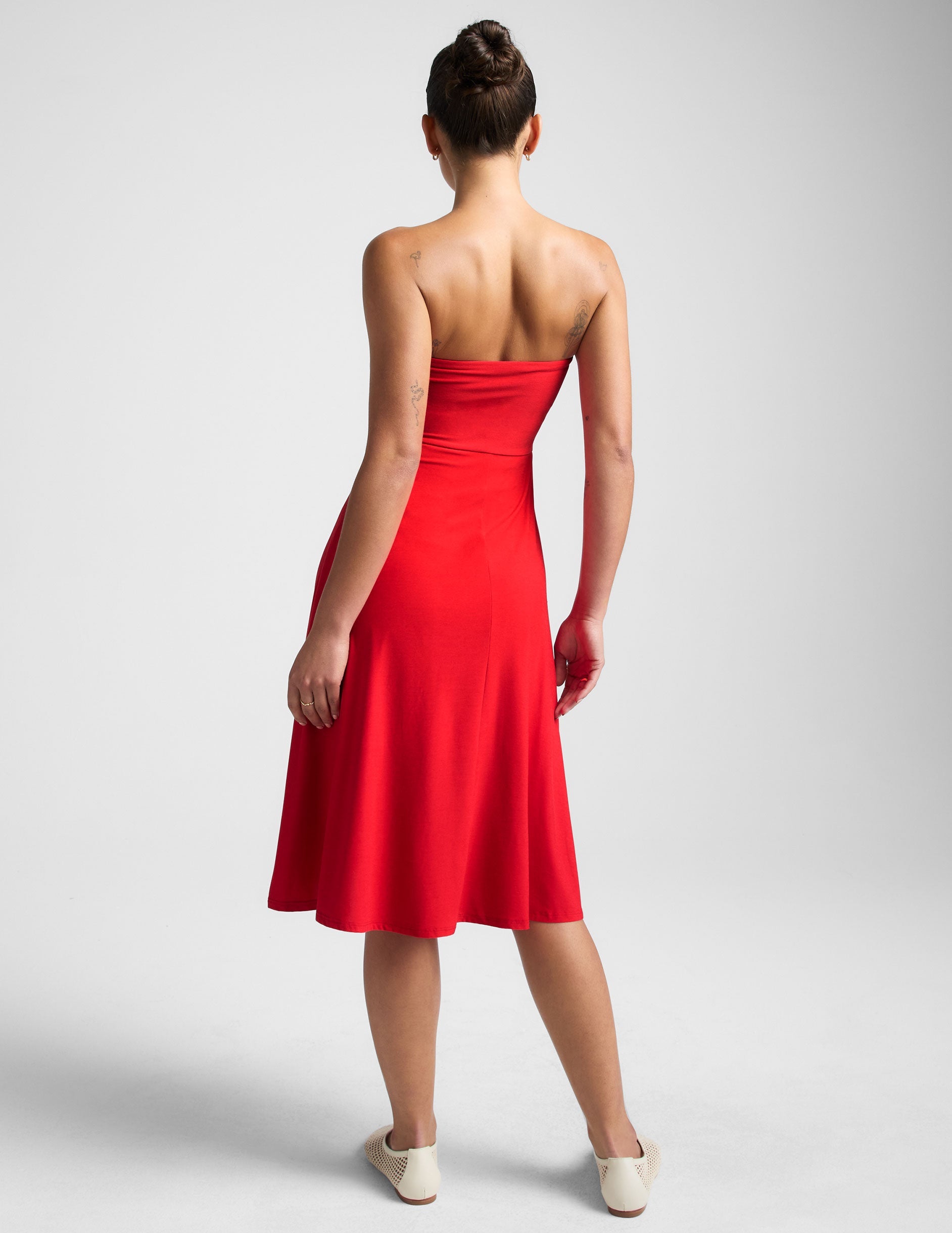 red strapless midi dress with pockets.
