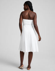 white midi length strapless dress with pockets.