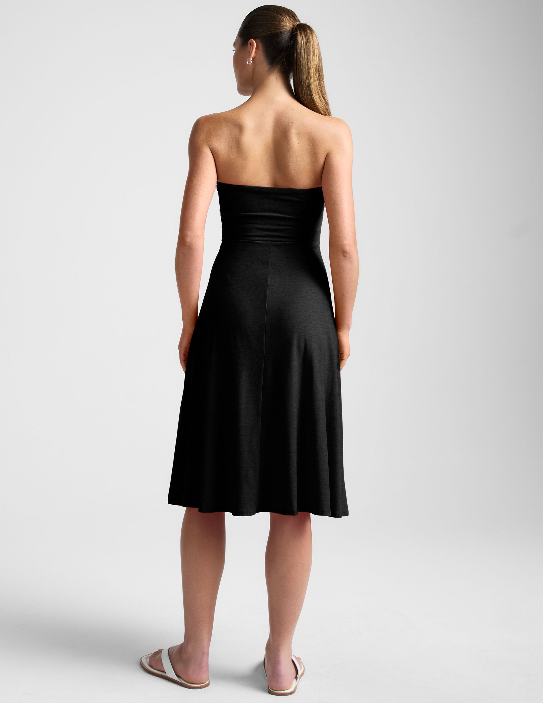 black strapless midi dress with pockets.