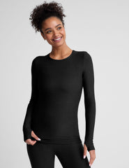 black crew neck long sleeve top with thumb holes.