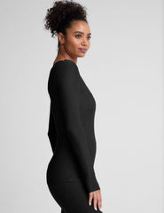 black crew neck long sleeve top with thumb holes.