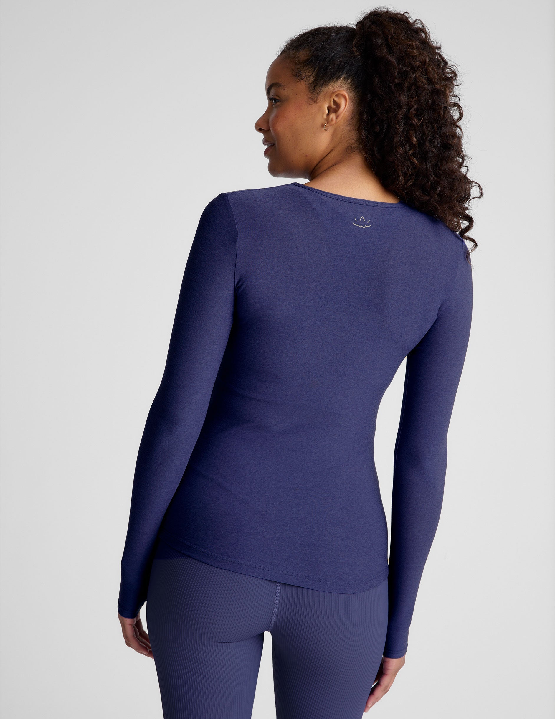 blue long sleeve top with a crew neckline.