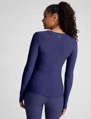blue long sleeve top with a crew neckline.