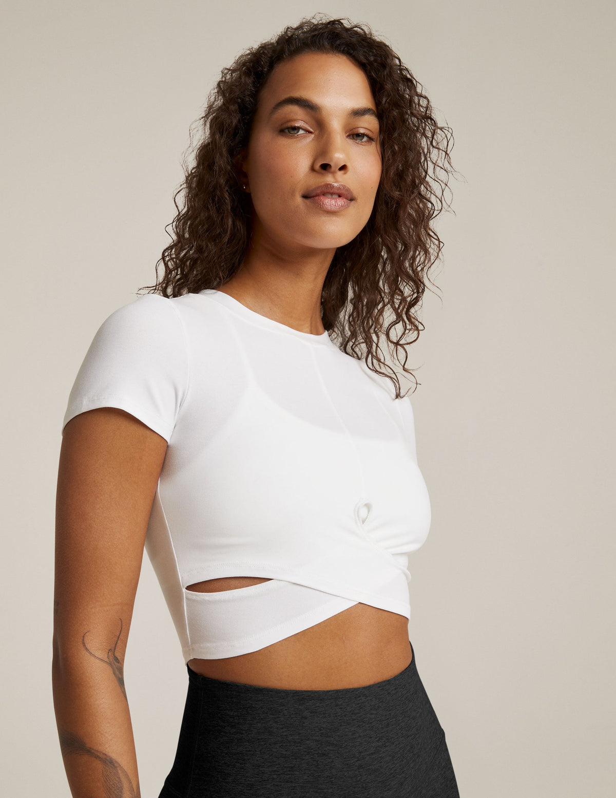 white short sleeve top with criss cross detail at front