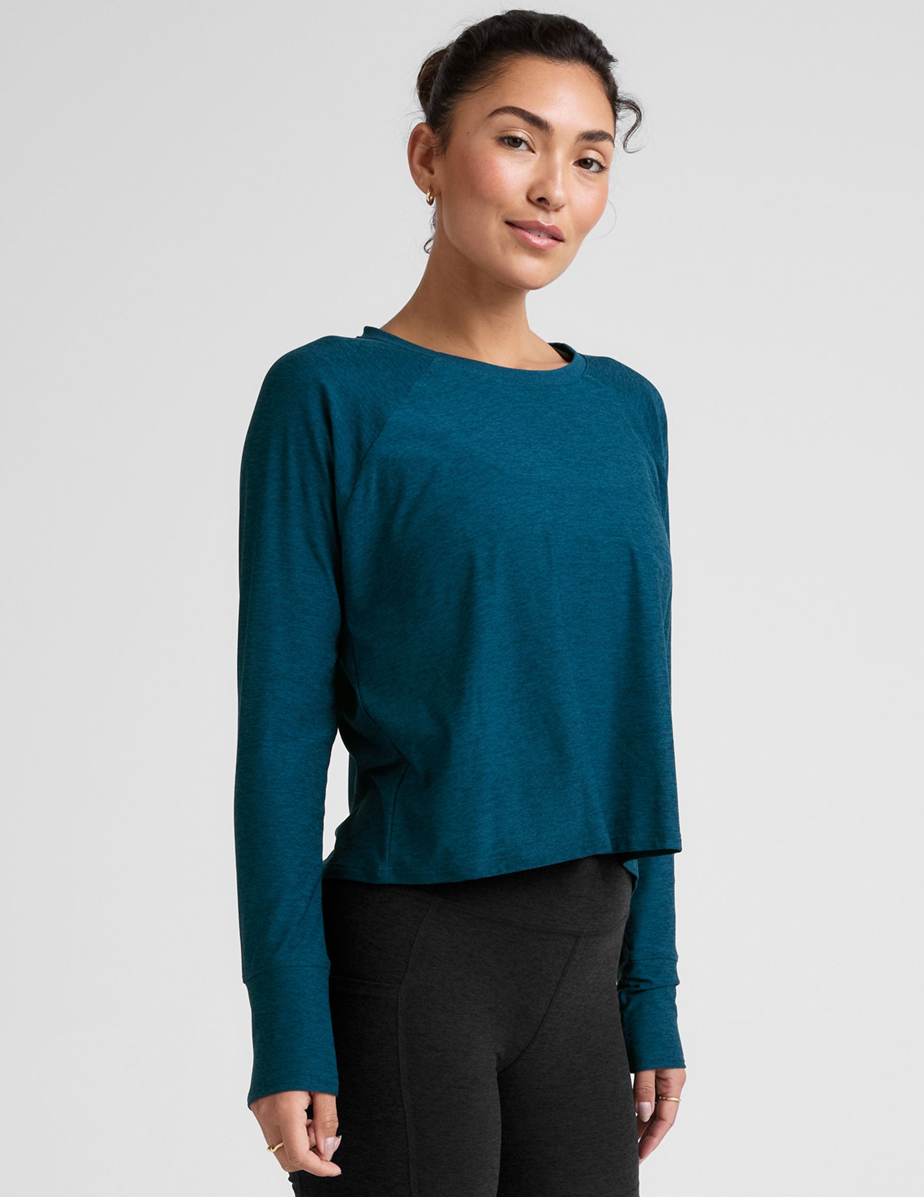 blue long sleeve crew neck top.
