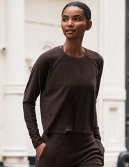 brown long sleeve crew neck top.