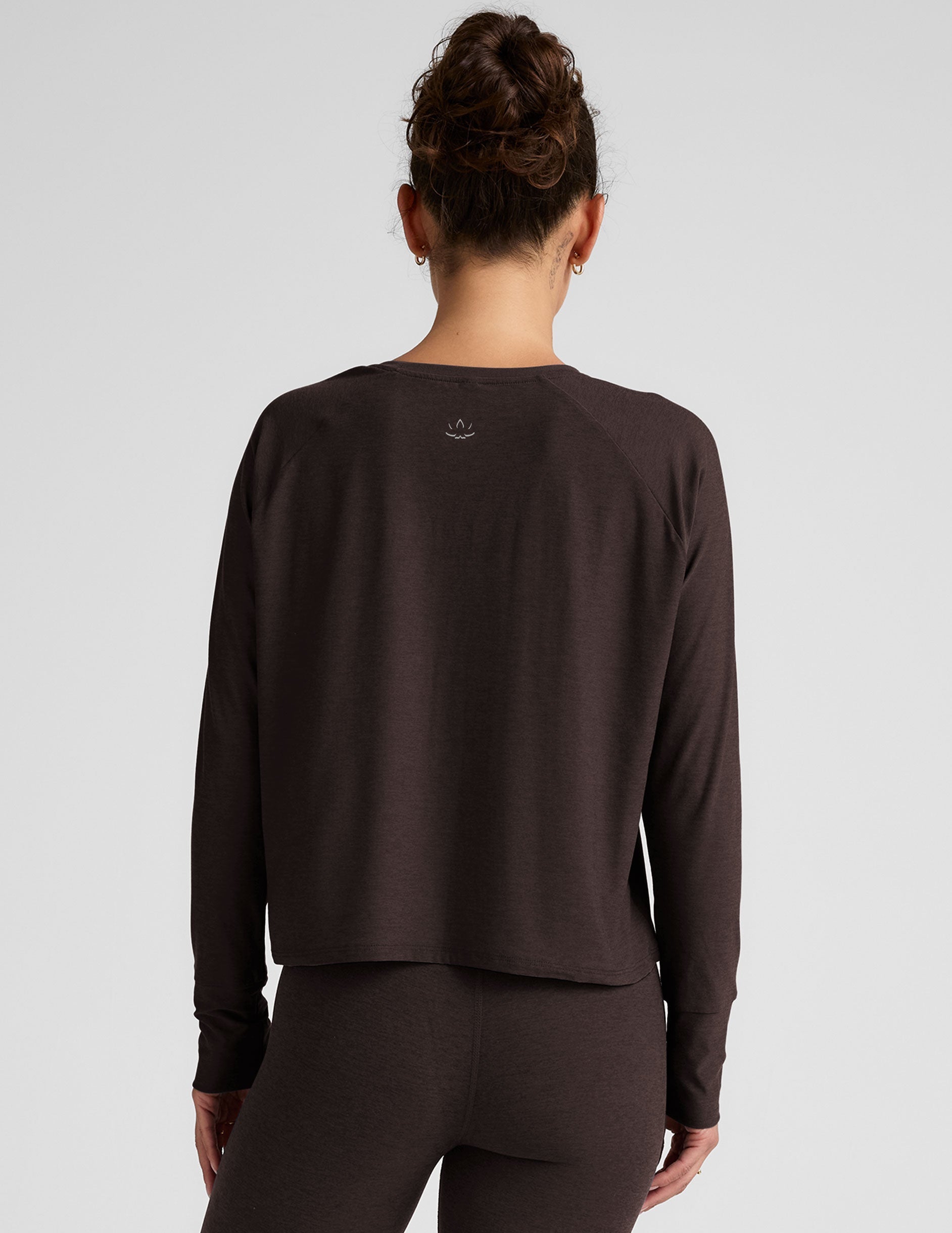 brown long sleeve crew neck top.