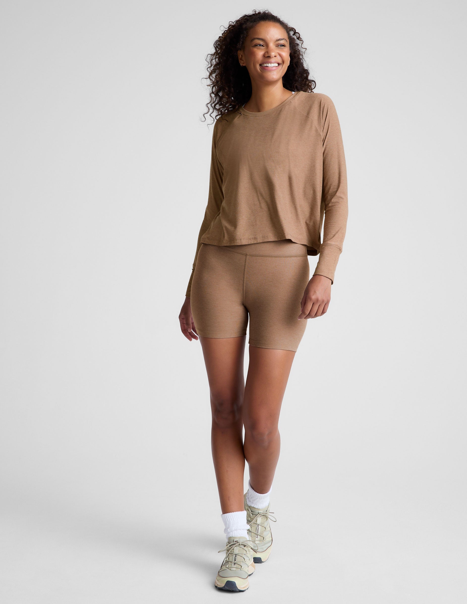 brown long sleeve top with a scoop neckline.