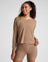 brown long sleeve top with a scoop neckline.