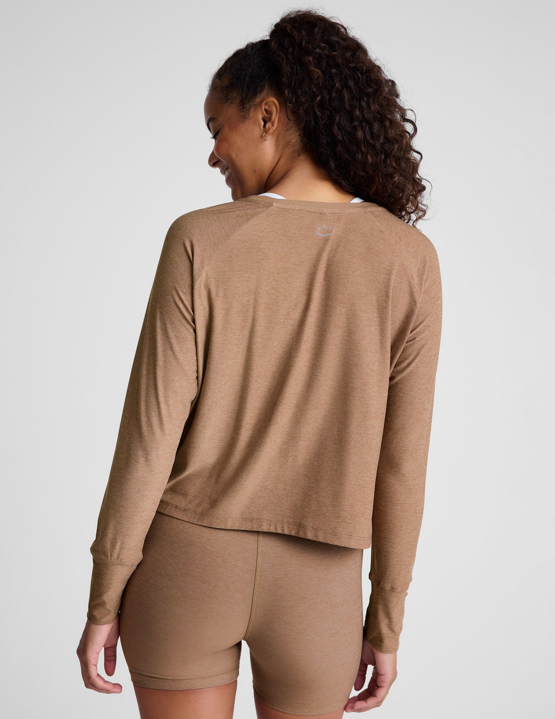 brown long sleeve top with a scoop neckline.