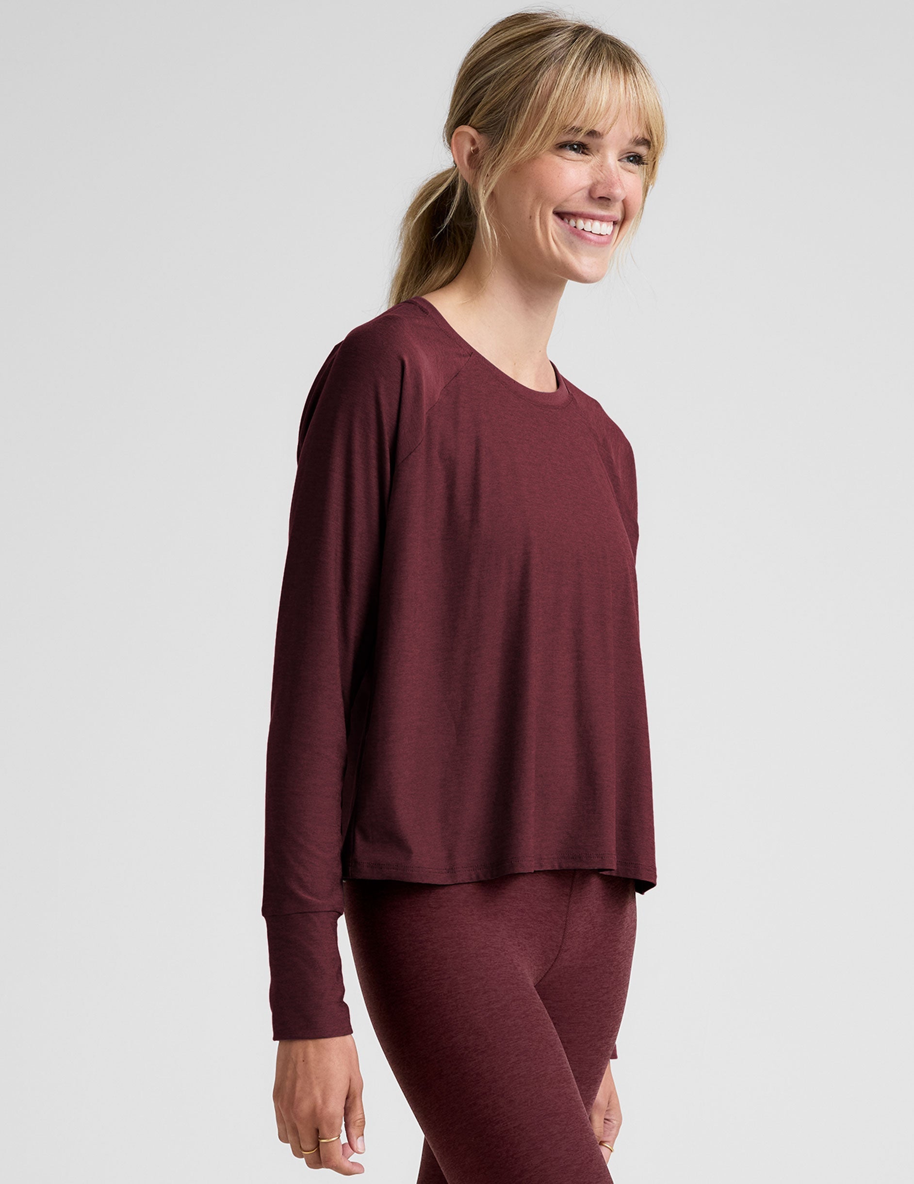 red scoop neck long sleeve relaxed fit top.