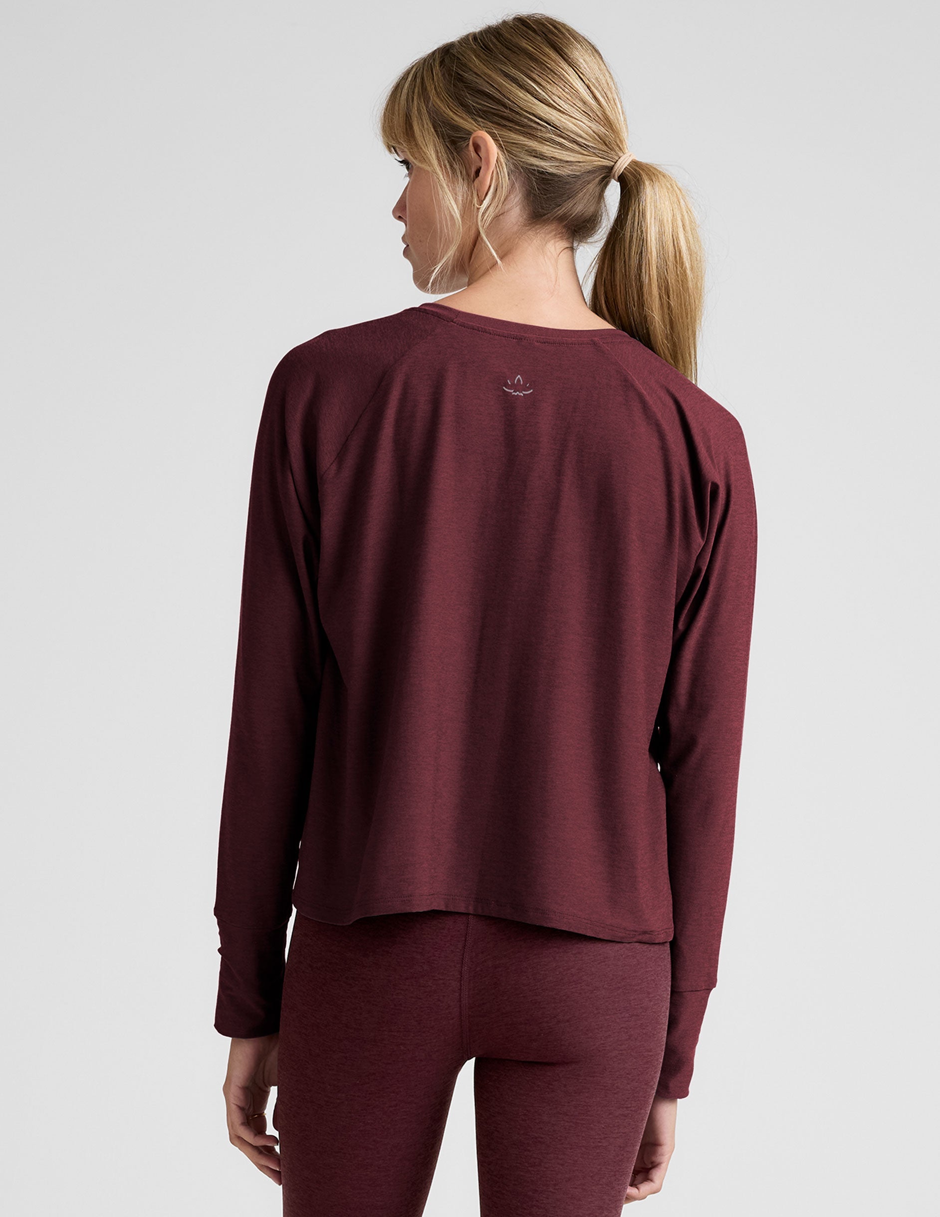 red scoop neck long sleeve relaxed fit top.