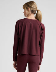 red scoop neck long sleeve relaxed fit top.