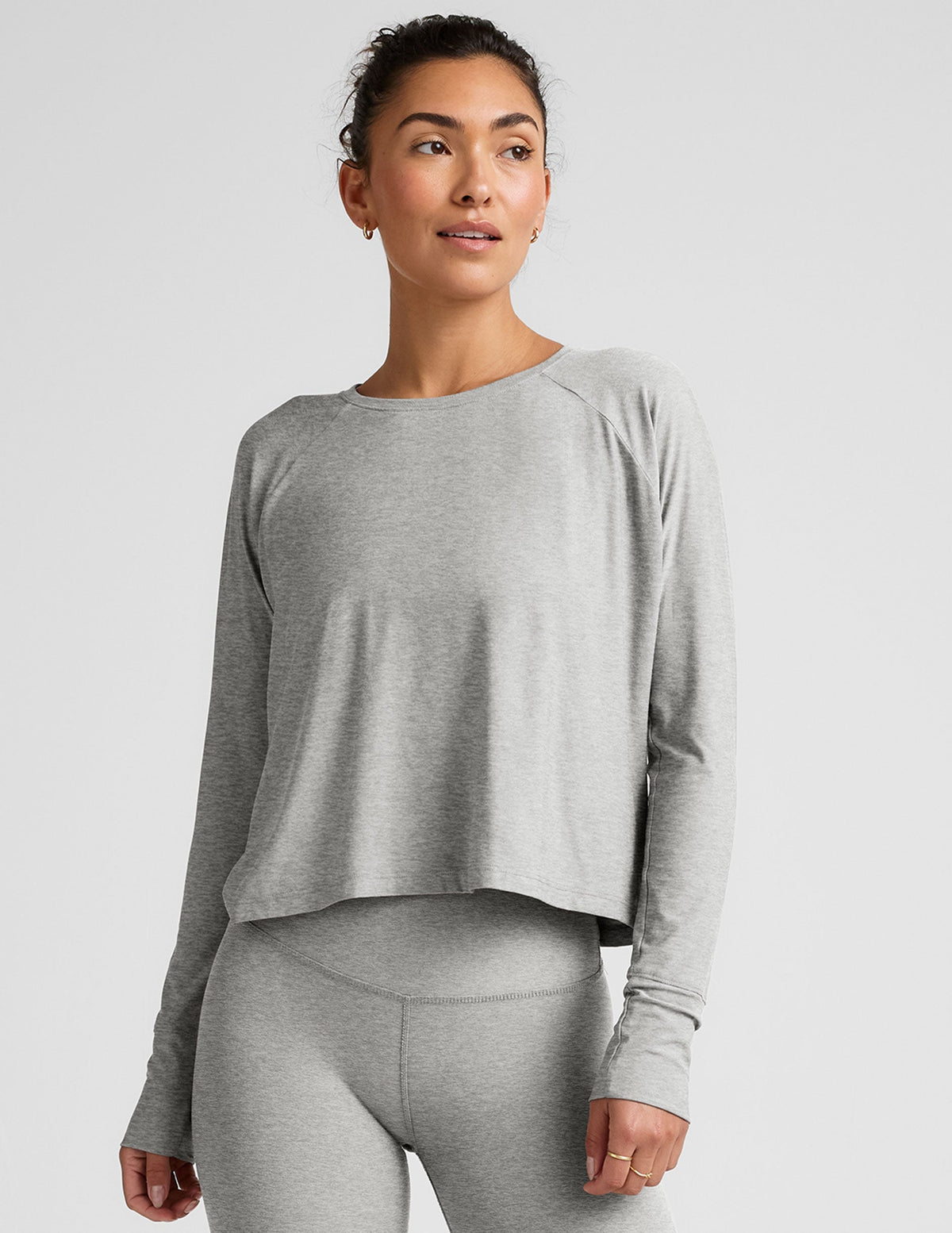 gray long sleeve crew neck top.