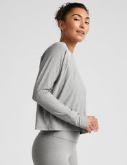 gray long sleeve crew neck top.