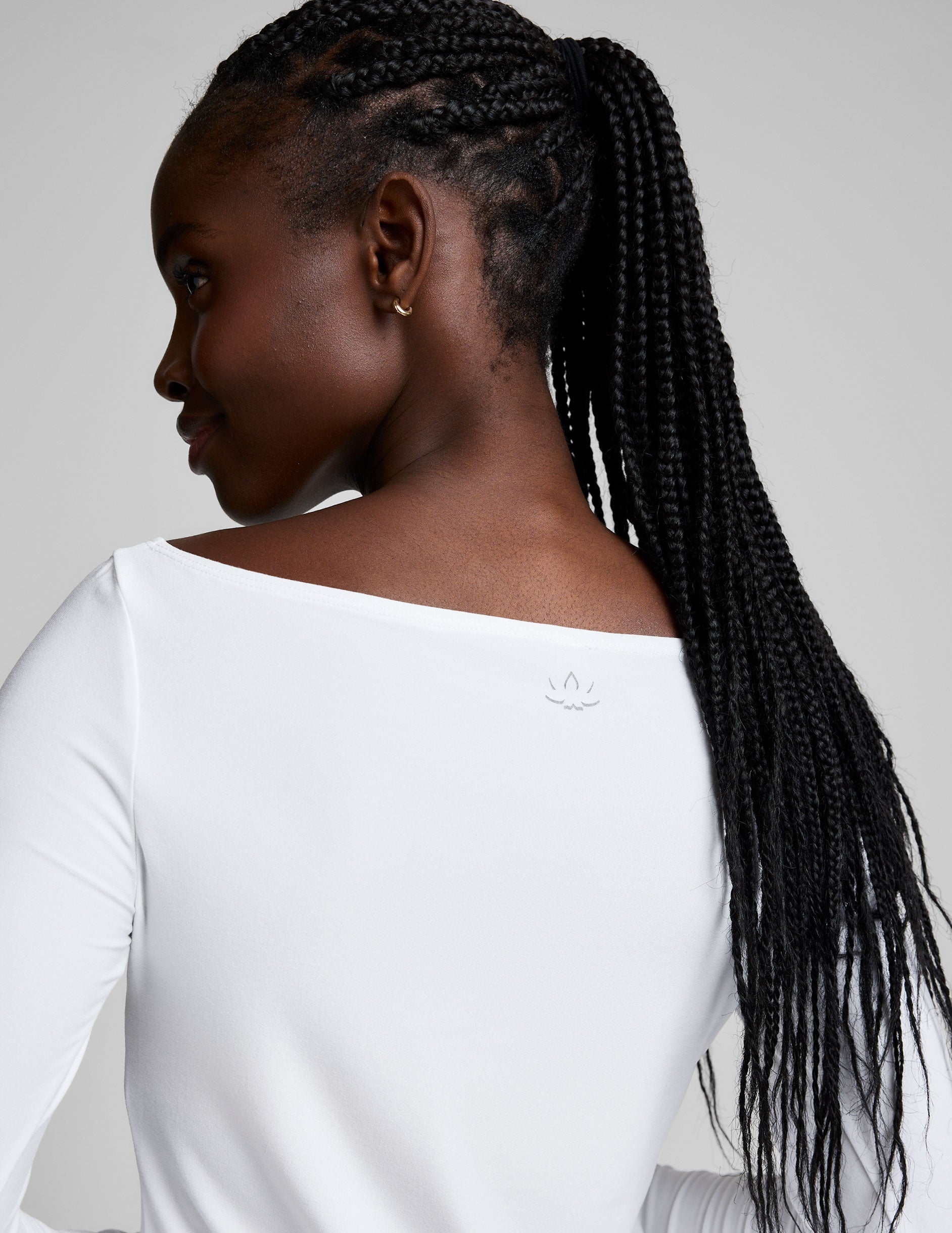 white boatneck long sleeve top.