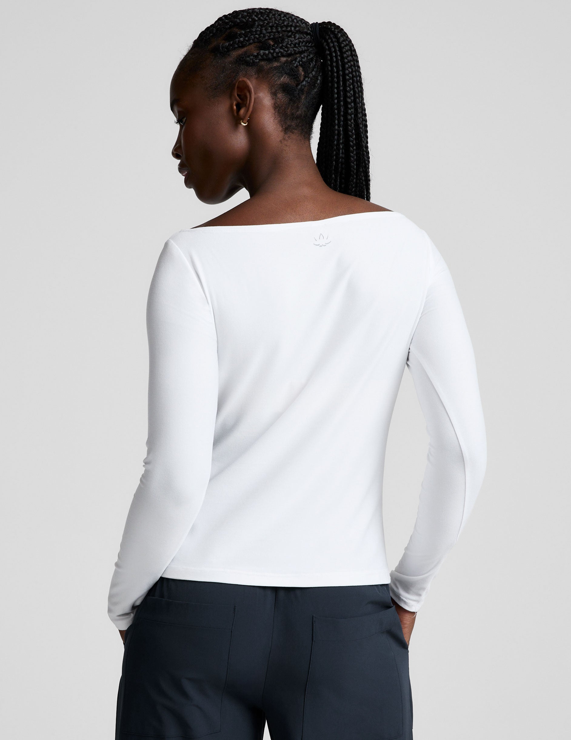 white boatneck long sleeve top.