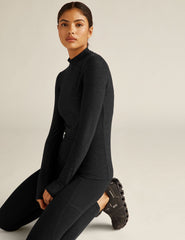 black mock neck pullover.