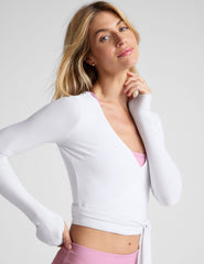white true wrap top with thumb holes.
