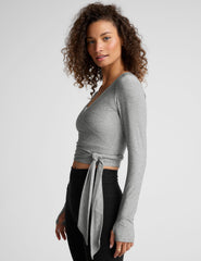 gray long sleeve wrap top with thumb holes.